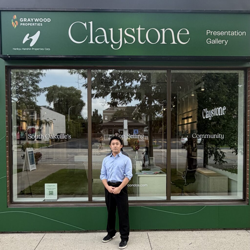 A man standing front of the building