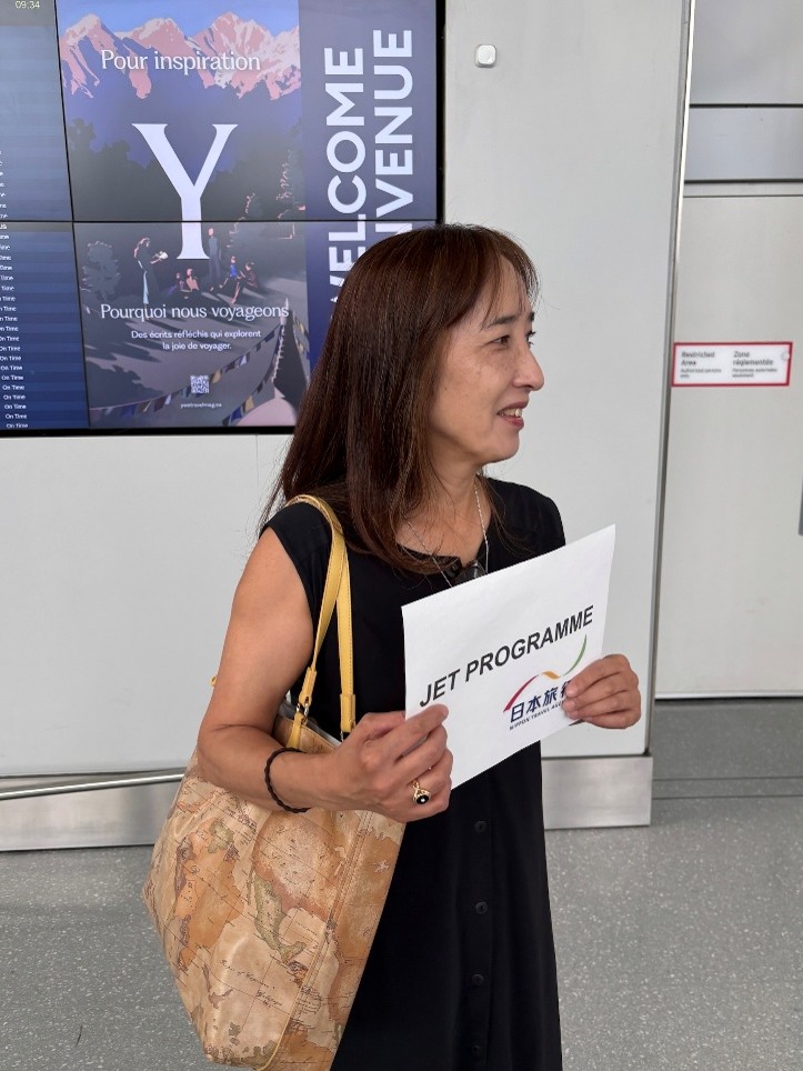 A woman holding a sign